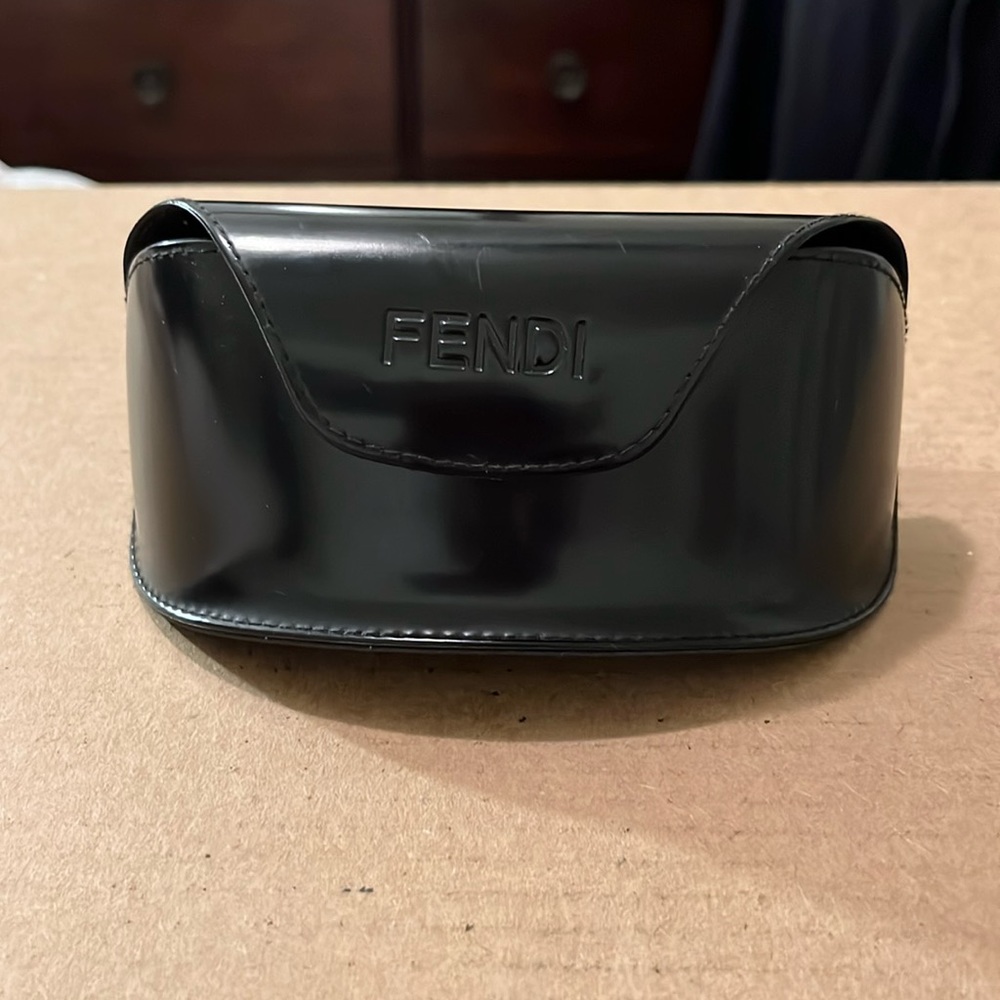 These are authentic Fendi sunglasses. minuet scratch on right side top of frame